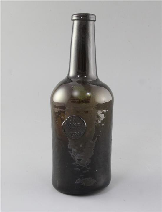 A George III black glass mallet shaped wine bottle, sealed for Jas. Oakes, Bury, 1788, height 26.5cm